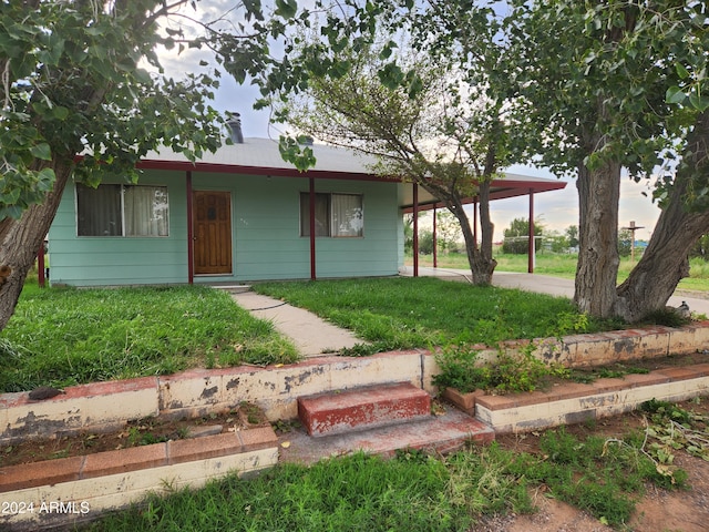 view of front of property with a carport