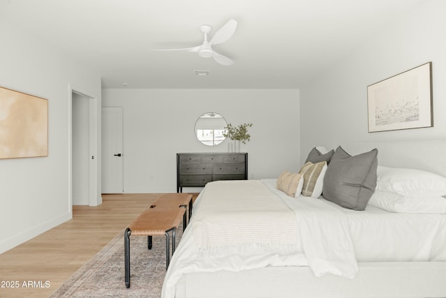 bedroom featuring light wood-type flooring and ceiling fan