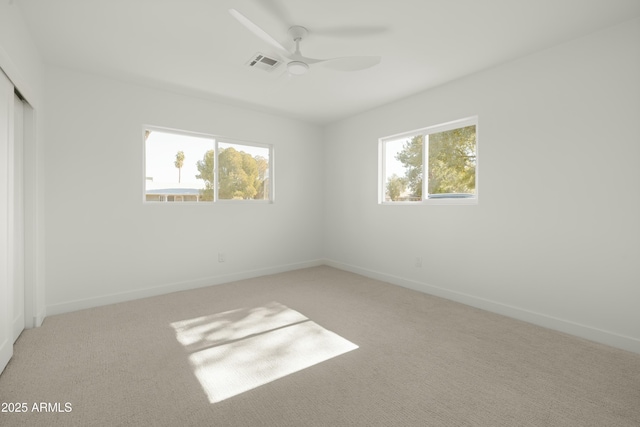 unfurnished bedroom featuring ceiling fan, carpet floors, and a closet