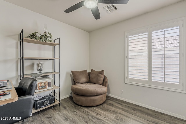 living area featuring ceiling fan, baseboards, visible vents, and wood finished floors