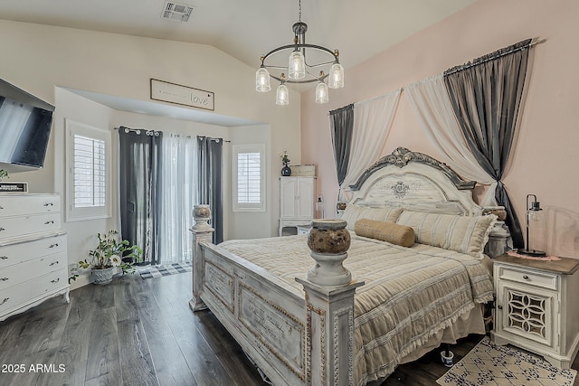 bedroom featuring multiple windows, dark wood finished floors, visible vents, and lofted ceiling