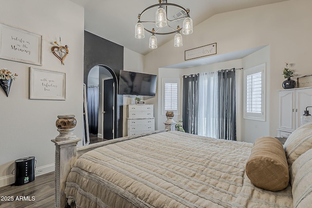 bedroom featuring baseboards, an inviting chandelier, high vaulted ceiling, wood finished floors, and arched walkways