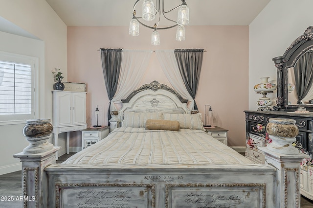 bedroom with baseboards and dark wood-type flooring
