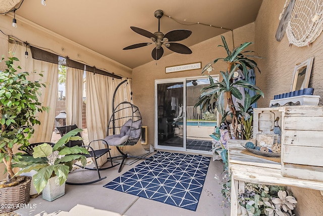 exterior space with ceiling fan