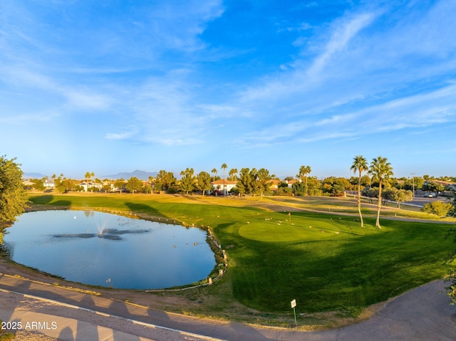 view of home's community featuring view of golf course and a water and mountain view