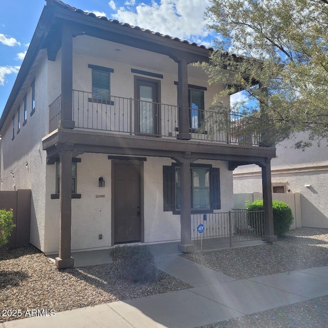 6908 S 8th Dr, Phoenix, AZ 85041 - view of front of property featuring a porch, fence, a balcony, and stucco siding