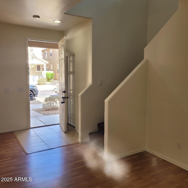 6908 S 8th Dr, Phoenix, AZ 85041 - foyer entrance featuring baseboards, wood finished floors, and stairway