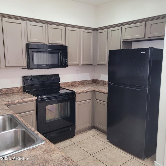 6908 S 8th Dr, Phoenix, AZ 85041 - kitchen featuring light tile patterned floors, gray cabinets, black appliances, and a sink