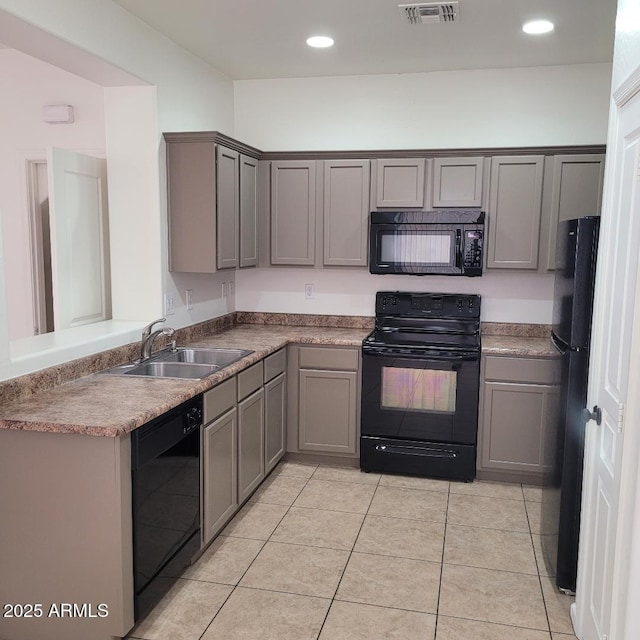 6908 S 8th Dr, Phoenix, AZ 85041 - kitchen with visible vents, a sink, gray cabinetry, black appliances, and light tile patterned flooring
