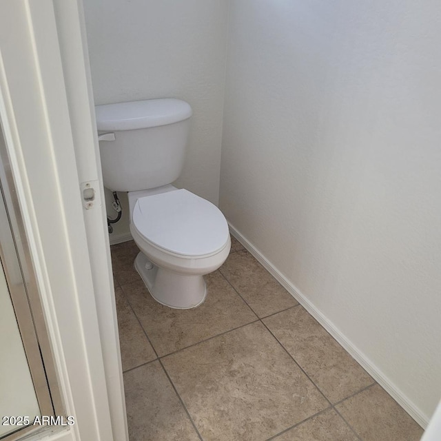 6908 S 8th Dr, Phoenix, AZ 85041 - bathroom featuring baseboards, tile patterned flooring, and toilet
