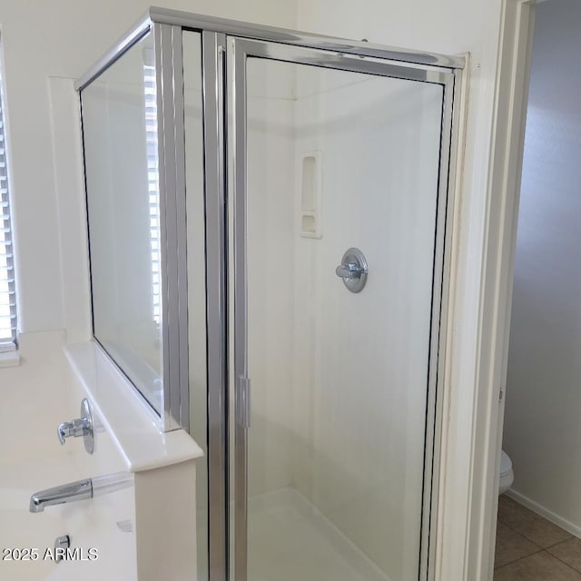 6908 S 8th Dr, Phoenix, AZ 85041 - bathroom with tile patterned flooring, toilet, and a shower stall