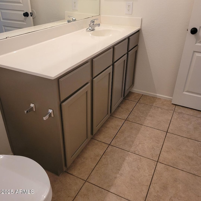 6908 S 8th Dr, Phoenix, AZ 85041 - bathroom featuring vanity, baseboards, tile patterned flooring, and toilet