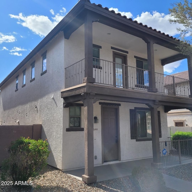 6908 S 8th Dr, Phoenix, AZ 85041 - exterior space featuring fence, a balcony, and stucco siding