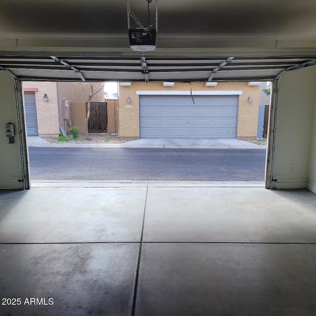 6908 S 8th Dr, Phoenix, AZ 85041 - garage featuring a garage door opener