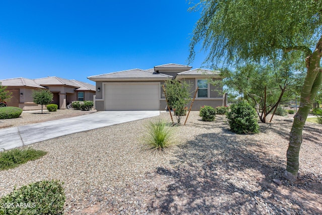 17728 W Paraiso Dr, Surprise, AZ 85387 - prairie-style house with stucco siding, driveway, an attached garage, and a tiled roof