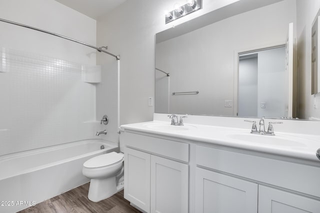 17728 W Paraiso Dr, Surprise, AZ 85387 - bathroom with double vanity, bathing tub / shower combination, wood finished floors, and toilet