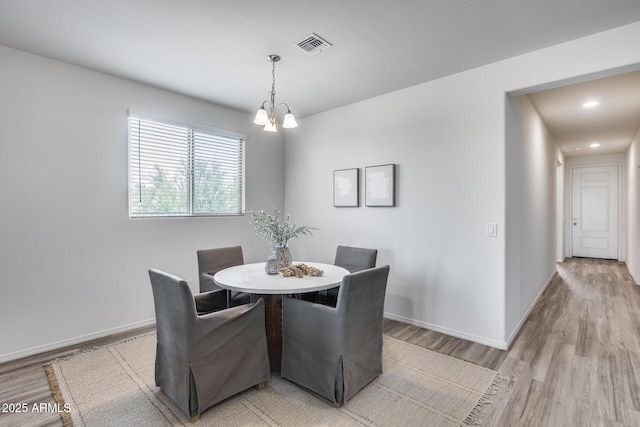 17728 W Paraiso Dr, Surprise, AZ 85387 - dining area featuring light wood-type flooring, a chandelier, baseboards, and recessed lighting