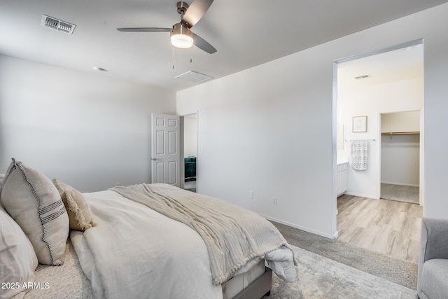 17728 W Paraiso Dr, Surprise, AZ 85387 - bedroom with ceiling fan, baseboards, and a walk in closet