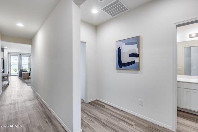 17728 W Paraiso Dr, Surprise, AZ 85387 - corridor featuring light wood-type flooring and baseboards