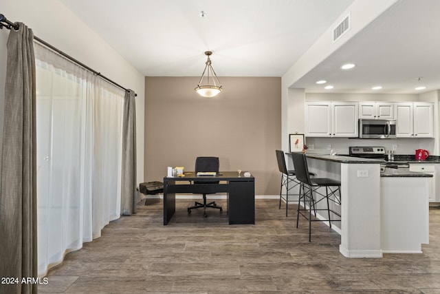 office area with hardwood / wood-style floors