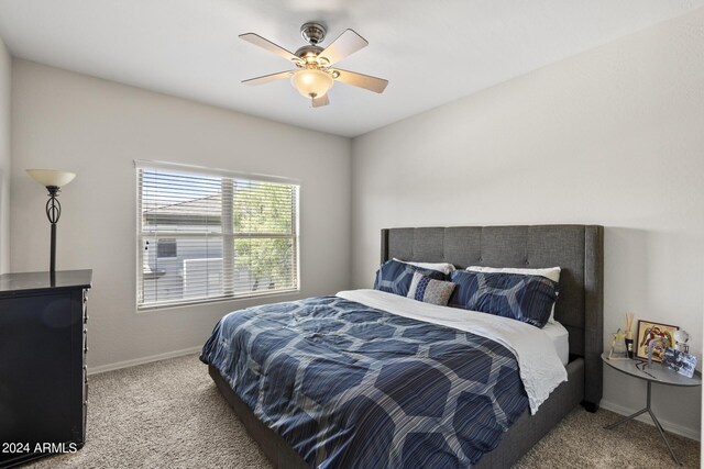 bedroom with ceiling fan and carpet flooring