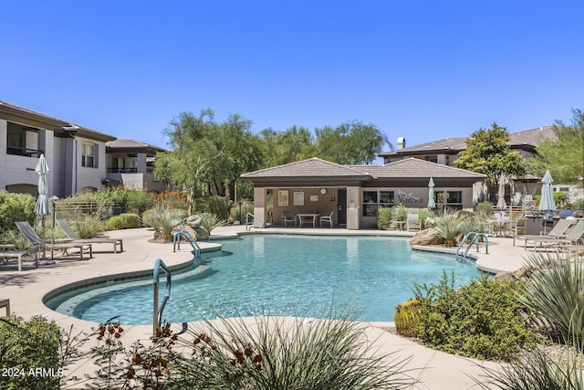 view of pool featuring a patio