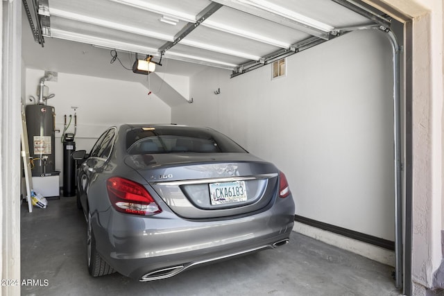 garage featuring a garage door opener and gas water heater