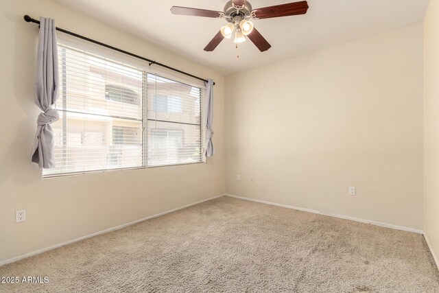 2134 E Broadway Rd Unit 1062, Tempe, AZ 85282 - unfurnished room with carpet flooring, ceiling fan, and baseboards