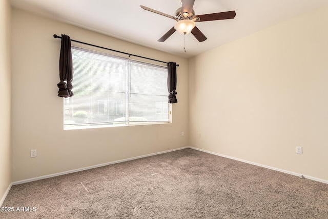 2134 E Broadway Rd Unit 1062, Tempe, AZ 85282 - carpeted spare room with ceiling fan and baseboards