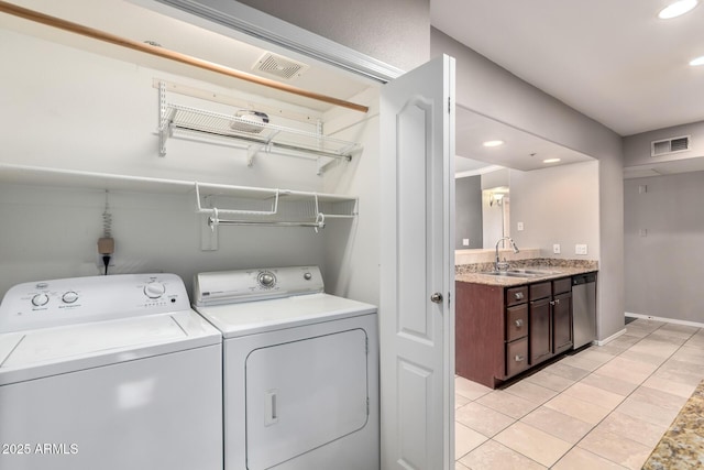 2134 E Broadway Rd Unit 1062, Tempe, AZ 85282 - washroom with independent washer and dryer, light tile patterned floors, and recessed lighting