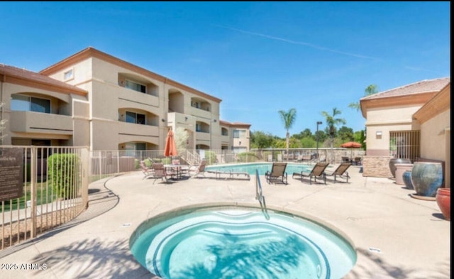 2134 E Broadway Rd Unit 1062, Tempe, AZ 85282 - community pool featuring a hot tub, a patio area, and fence