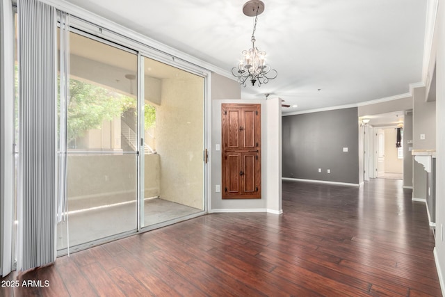 2134 E Broadway Rd Unit 1062, Tempe, AZ 85282 - unfurnished room featuring crown molding, a chandelier, wood finished floors, and baseboards