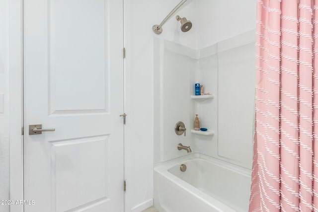 bathroom with shower / tub combo with curtain