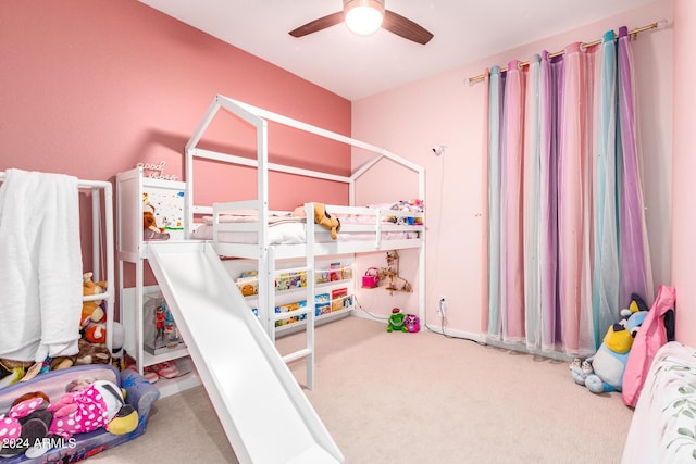 carpeted bedroom featuring ceiling fan and radiator heating unit