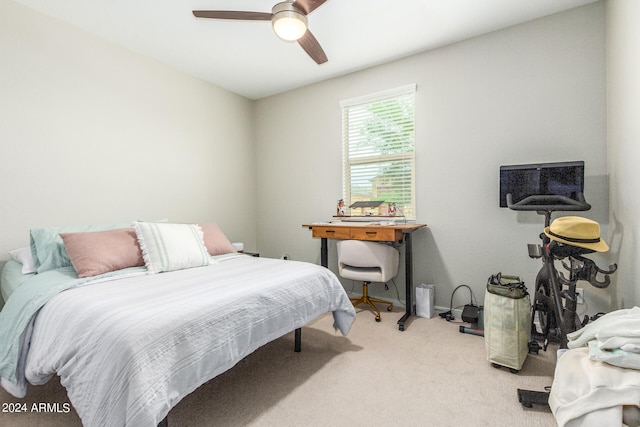 bedroom with light carpet and ceiling fan