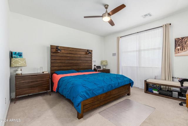 carpeted bedroom featuring ceiling fan