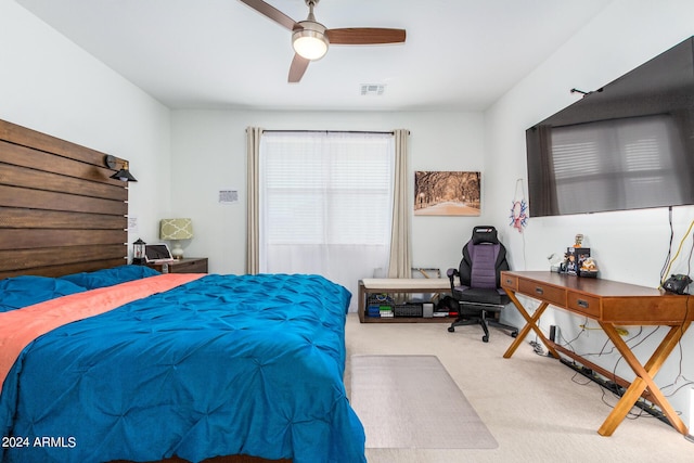 bedroom featuring ceiling fan and light carpet