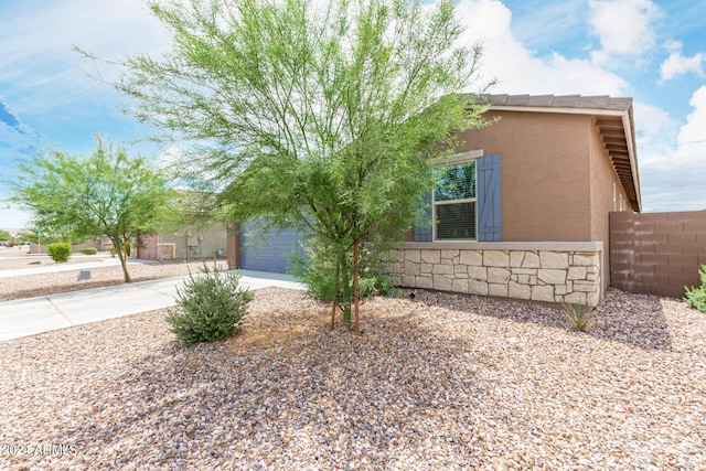 view of property exterior featuring a garage