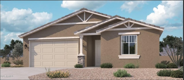 15755 W Camden Ave, Waddell, AZ 85355 - view of front of house with concrete driveway, stucco siding, and an attached garage