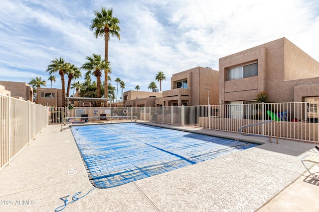 view of swimming pool with a patio area