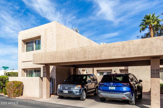 exterior space with a carport