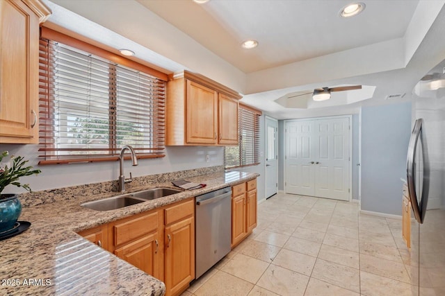 8545 E Heatherbrae Dr, Scottsdale, AZ 85251 - kitchen featuring appliances with stainless steel finishes, a sink, a ceiling fan, recessed lighting, and light stone countertops