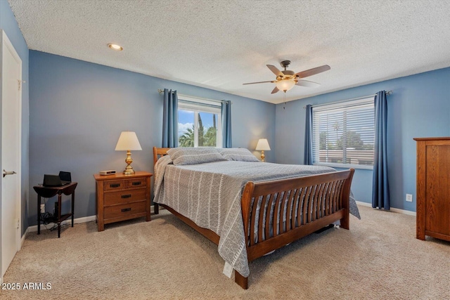 8545 E Heatherbrae Dr, Scottsdale, AZ 85251 - bedroom with light colored carpet, a ceiling fan, a textured ceiling, and baseboards