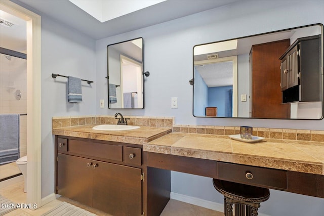 8545 E Heatherbrae Dr, Scottsdale, AZ 85251 - bathroom with vanity, toilet, a shower, and tile patterned floors