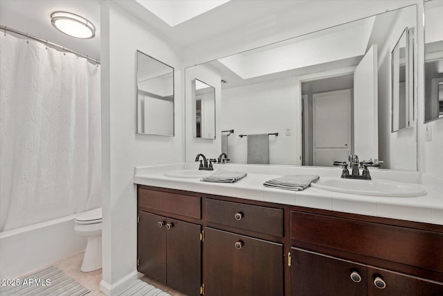8545 E Heatherbrae Dr, Scottsdale, AZ 85251 - bathroom featuring toilet, double vanity, tile patterned flooring, and shower / bathtub combination with curtain