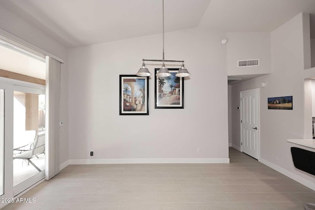 unfurnished dining area featuring visible vents, lofted ceiling, and baseboards