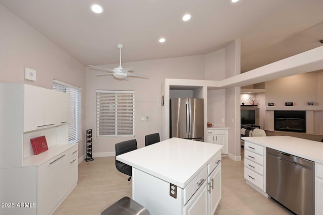 kitchen with recessed lighting, white cabinetry, stainless steel appliances, and light countertops