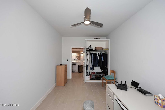 bedroom with a ceiling fan, visible vents, baseboards, and a closet