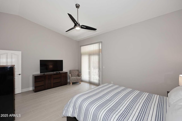 bedroom featuring vaulted ceiling, baseboards, and ceiling fan