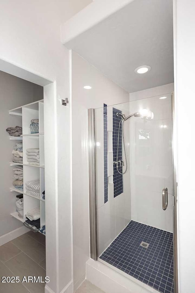 bathroom with a shower stall